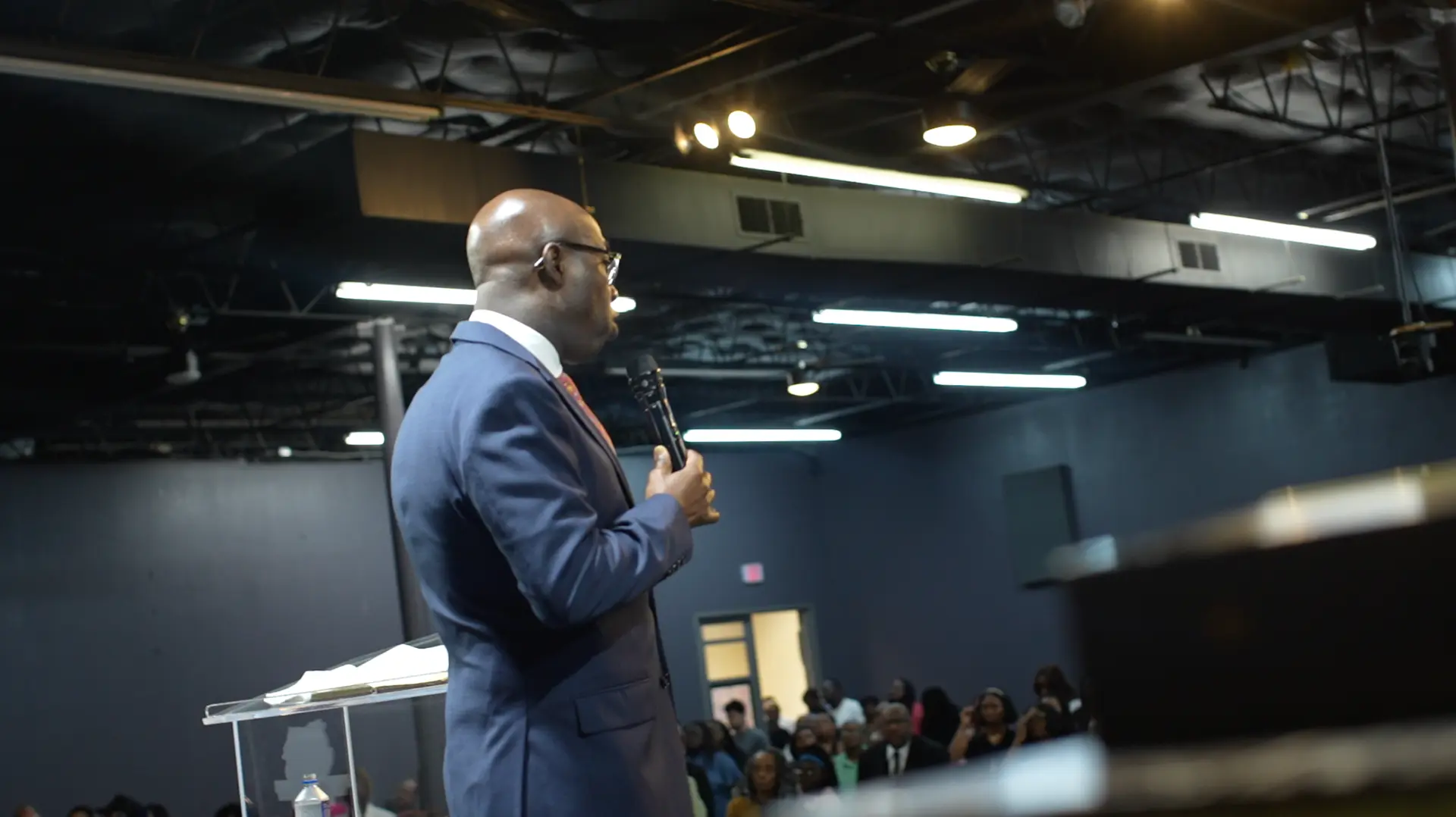 Apostle Frank Manu ministering the Word to the congregation